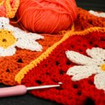 Crocheted squares with yarn and hook